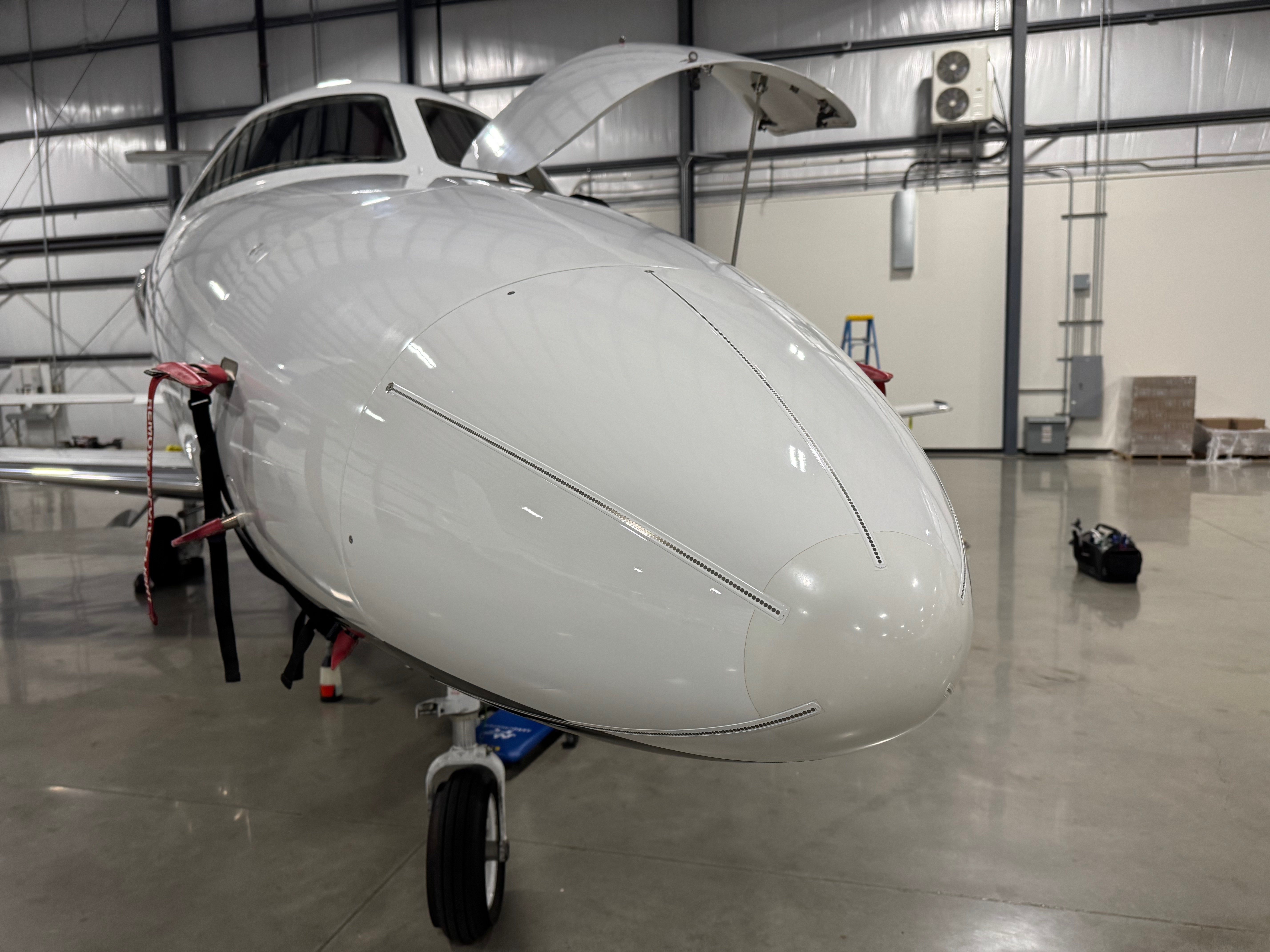 Ceramic coating and paint correction on a business jet nose at KSJC San Jose